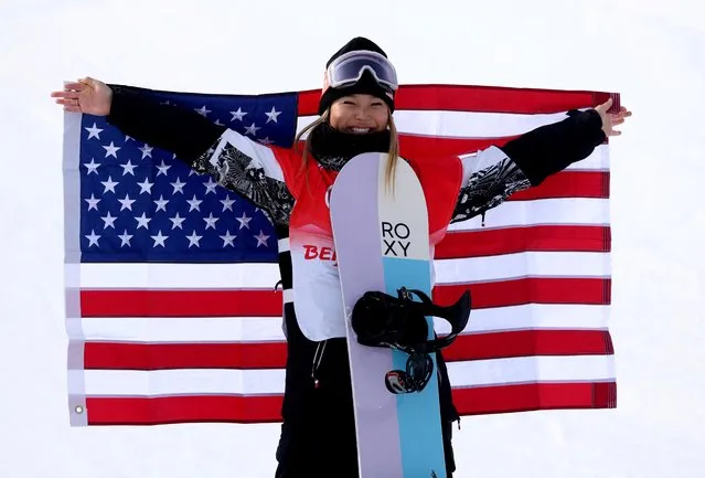 Chloe Kim of the United States celebrates with the United States flag after winning the gold medal in the Women's Snowboard Halfpipe Final at Genting Snow Park during the Winter Olympic Games on February 10th, 2022 in Zhangjiakou, China. (Photo by Mike Blake/Reuters)