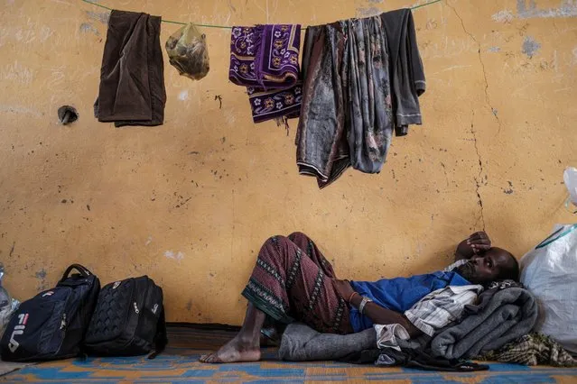 An internally displaced man rests in a classroom in a school where he is sheltered in the village of Afdera, 225 kms of Semera, Ethiopia, on February 15, 2022. (Photo by Eduardo Soteras/AFP Photo)
