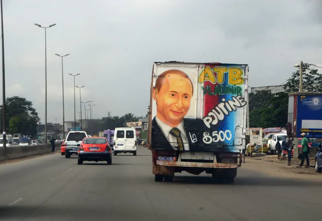 A transport vehicle carries a picture of Russian President Vladimir Putin in Adjame, a district of Abidjan, Ivory Coast, 04 September 2019. (Photo by Legnan Koula/EPA/EFE)