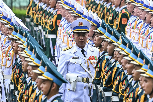 Vietnamese soldiers prepare before the start of a welcome ceremony for Russia's President Vladimir Putin at the Presidential Palace in Hanoi on June 20, 2024. (Photo by Manan Vatsyayana/AFP Photo)