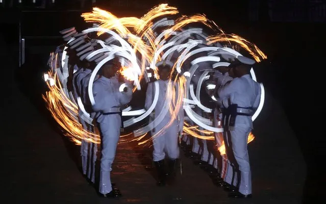 Indian navy personnel display their skills during Naval Day celebrations in Mumbai, India, Wednesday, December 4, 2019. (Photo by Rafiq Maqbool/AP Photo)