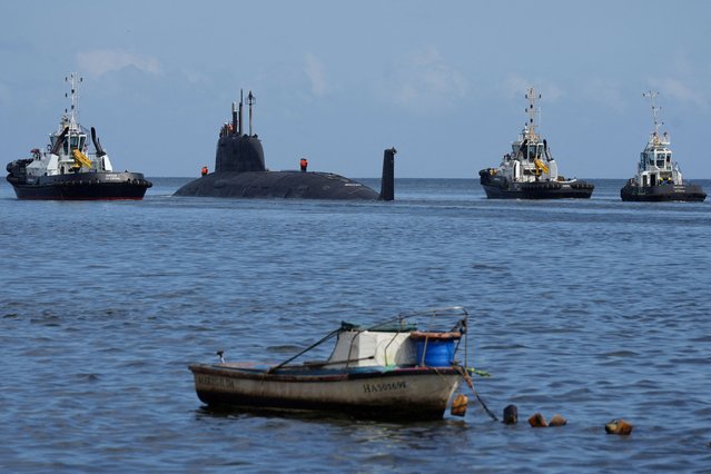 Russian nuclear-powered cruise missile submarine Kazan is escorted by tugboats as it departs from Havana's bay, Cuba, on June 17, 2024. (Photo by Alexandre Meneghini/Reuters)