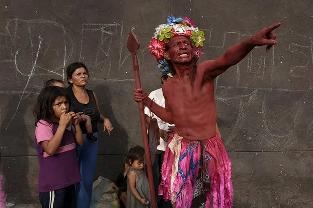 A man dressed as a Red Indian takes part in celebrations honouring the patron saint of Managua, Santo Domingo de Guzman, in Managua, Nicaragua August  9, 2015. (Photo by Oswaldo Rivas/Reuters)
