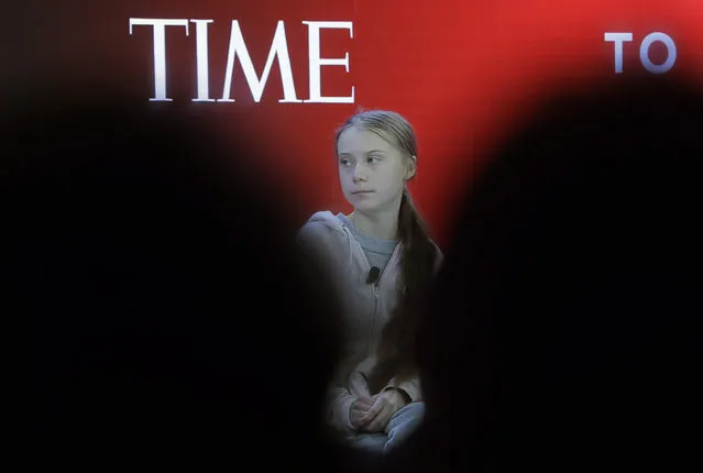Swedish environmental activist Greta Thunberg takes her seat prior to the opening session of the World Economic Forum in Davos, Switzerland, Tuesday, January 21, 2020. The 50th annual meeting of the forum will take place in Davos from Jan. 20 until Jan. 24, 2020. (Photo by Markus Schreiber/AP Photo)