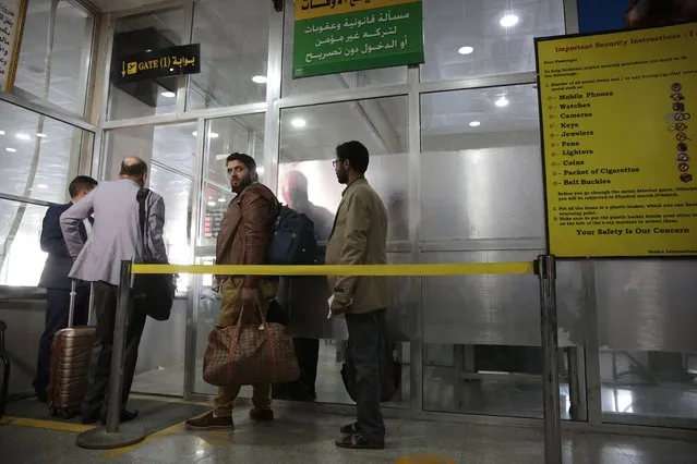 Yemenis queue at the departure lounge to board the first commercial flight at Sanaa airport, Yemen, Monday, May, 16, 2022. (Photo by Hani Mohammed/AP Photo)