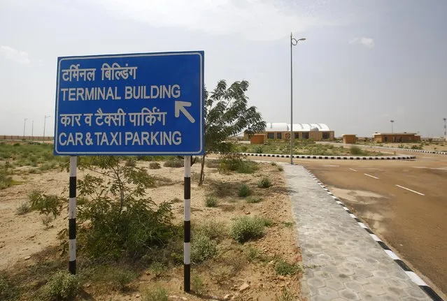 A signboard is seen outside the Jaisalmer Airport in desert state of Rajasthan, India, August 13, 2015. (Photo by Anindito Mukherjee/Reuters)