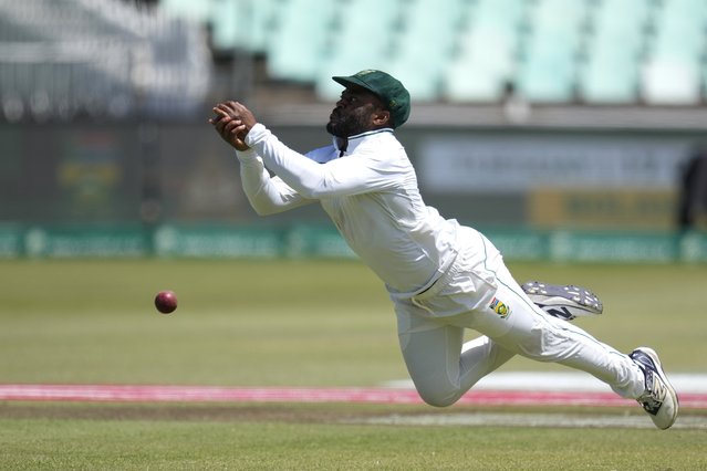South Africa's captain Temba Bavuma misses a catch during the fourth day of the first Test cricket match between South Africa and Sri Lanka, at Kingsmead stadium in Durban, South Africa, Saturday, November 30, 2024. (Photo by Themba Hadebe/AP Photo)