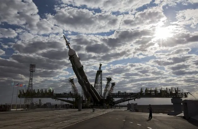 The Soyuz TMA-18M spacecraft is lifted on its launch pad at the Baikonur cosmodrome, Kazakhstan, August 31, 2015. (Photo by Shamil Zhumatov/Reuters)