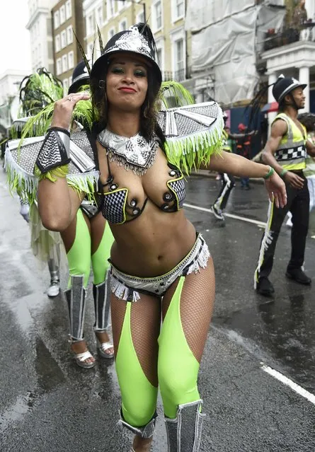 A reveller dances as she takes part in the Notting Hill Carnival in west London, August 25, 2014. (Photo by Toby Melville/Reuters)