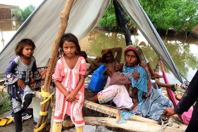 People affected by floods take shelter in Hyderabad, Pakistan, 25 August 2022. (Photo by Nadeem Khawar/EPA/EFE)