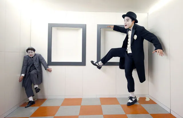 Left to right) Yeong-min Lee and Jeong-Seok Mun,  two of the chaplinesque magicians from The Tricksters explore the inside of a perspective room at Edinburgh's Camera Obscura and World of Illusions during the Edinburgh Festival on Thursday August 18, 2016.  The Tricksters, from South Korea, are performing in the show SNAP in their Edinburgh Festival debut. Photo credit should read: (Photo by Jane Barlow/PA Wire)
