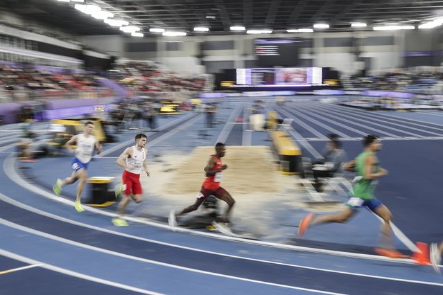 A photo taken with slow shutter speed shows athletes compete in the Men's 800m heat at the World Athletics Indoor Championships in Nanjing, China, 21 March 2025. (Photo by Andres Martinez Casares/EPA/EFE)