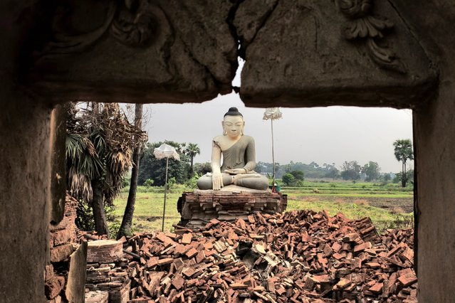 A Buddha statue is surrounded by debris in Inn Wa on the outskirts of Mandalay on April 6, 2025, following the devastating March 28 earthquake. The shallow 7.7-magnitude earthquake on March 28 flattened buildings across Myanmar, killing more than 3,400 people and making thousands more homeless. (Photo by AFP Photo/Stringer)