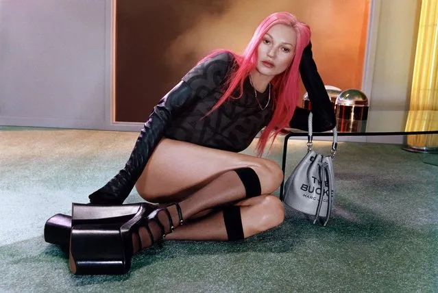 Kate Moss is pretty in pink in a new ad campaign for Marc Jacobs Resort in London in the second decade of December 2022. The 48-year-old British model showcases bright pink hair – rather than her usual blonde locks – in ads for the fashion brand. (Photo by Harley Weir/Marc Jacobs/The Mega Agency)