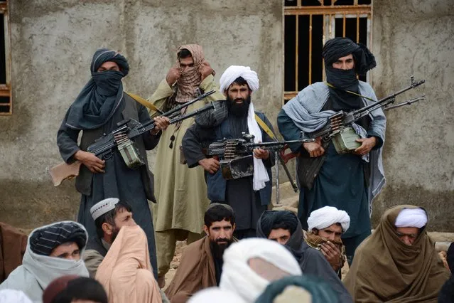 In this November 3, 2015 file photo, Afghan Taliban fighters listen to Mullah Mohammed Rasool, the newly-elected leader of a breakaway faction of the Taliban, in Farah province, Afghanistan. Despite US President Donald Trump’s pronouncement that there would be no talks with the Taliban following a series of deadly attacks in Kabul, officials say talks continue, but neither side trusts the other and neither believes the other negotiates independently. (Photo by AP Photo/Stringer)