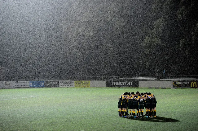Even When the Rain Falls. Sports teams gather and play across Australia despite the weather. (Photo by John Appleyard/Australian Life Prize 2015)