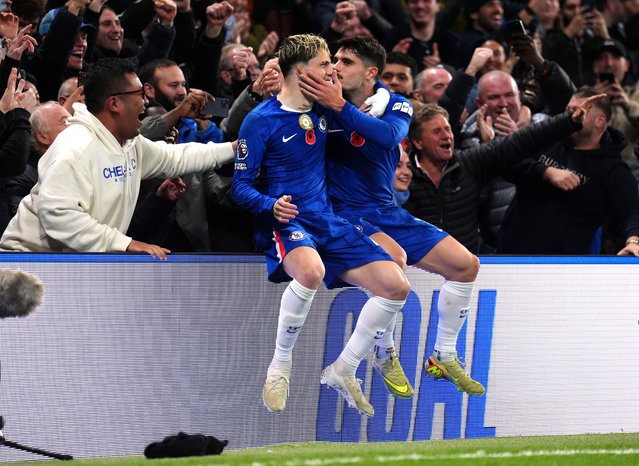Chelsea's Pedro Neto (right) celebrates scoring their side's third goal of the game with team-mate Alejandro Garnacho in front of the fans during the Premier League match at Stamford Bridge, London on Saturday, November 8, 2025. (Photo by John Walton/PA Wire)