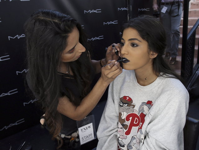 A makeup artist works on a model during the Tunis Fashion Week 2018 in Tunis, Tunisia, 12 May 2018. (Photo by Mohamed Messara/EPA/EFE)