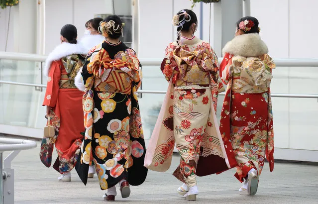 Twenty-year-old Japanese women in colorful kimonos walk to the ceremony for the Coming-of-Age Day amid outbreak of the new coronavirus in Yokohama, suburban Tokyo on Monay, January 11, 2021. Prime Minister Yoshihide Suga declared a state of emergency on Tokyo and three neighboring prefectures. (Photo by Yoshio Tsunoda/AFLO/Rex Features/Shutterstock)