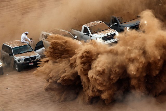 People gather as drifters perform in the desert of Umm Al Quwain in the United Arab Emirates, on December 1, 2025. (Photo by Fadel Senna/AFP via Getty Images)