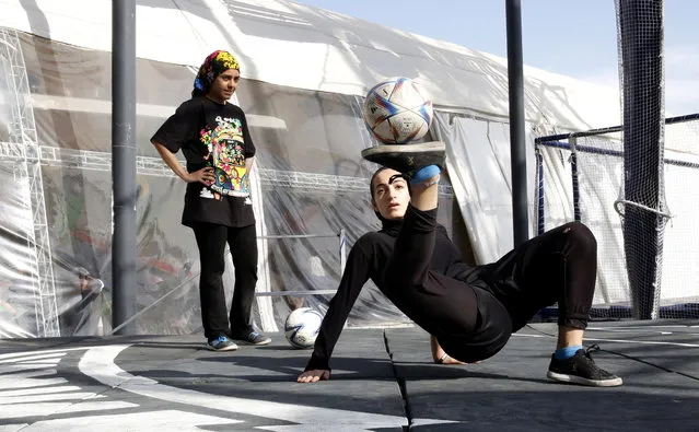 An Iranian girl performs during the Local Freestyle football championship 2023 at the Adrenalin park, in Tehran, Iran, 11 May 2023. (Photo by Abedin Taherkenareh/EPA)