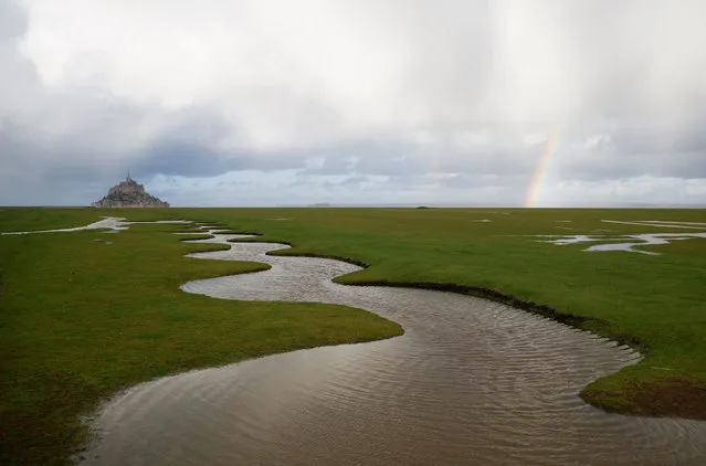 A rainbow appears near the iconic Mont Saint-Michel in the French western region of Normandy, France on January 16, 2023. (Photo by Stephane Mahe/Reuters)