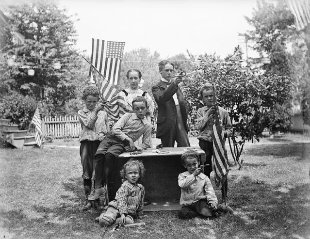 Family group with pistols and flags ready for 4th of July celebration, circa 1880's (Photo by Bettmann Archive/Getty Images)