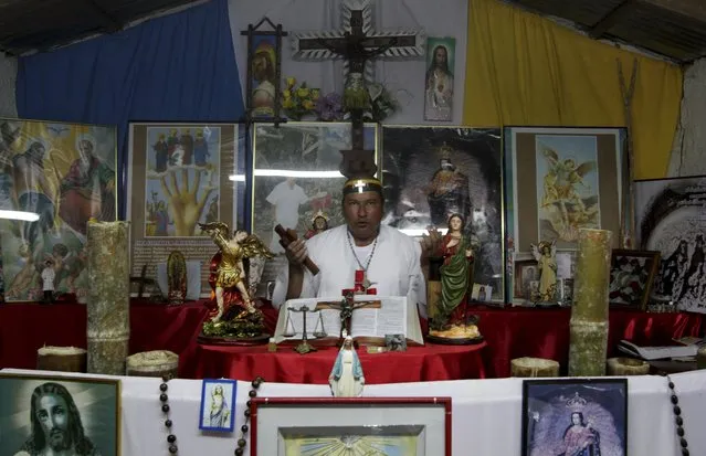 Hermes Cifuentes, who is also known as “Brother Hermes”, prays after performing an exorcism on Gisela Marulanda, 23, who claims to be possessed by spirits in La Cumbre, Valle July 7, 2012. Cifuentes says he has performed more than 35,000 exorcism rituals in the past 25 years. Picture taken July 7, 2012. REUTERS/Jaime Saldarriaga  (COLOMBIA - Tags: SOCIETY RELIGION)
