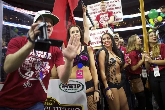 Cheerleaders supporting participants wait for their turn at a parade before the 23rd annual Wing Bowl at the Wells Fargo Center in Philadelphia, Pennsylvania January 30, 2015. (Photo by Mark Makela/Reuters)