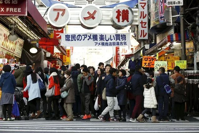 People crowd Ameyoko market as they shop for food and goods for the upcoming New Year holidays in Tokyo, Japan, December 30, 2015. (Photo by Thomas Peter/Reuters)