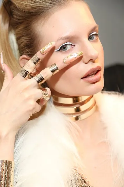A model prepares backstage at The Blonds fashion show during Mercedes-Benz Fashion Week Fall 2015 at Milk Studios on February 18, 2015 in New York City. (Photo by Monica Schipper/Getty Images)