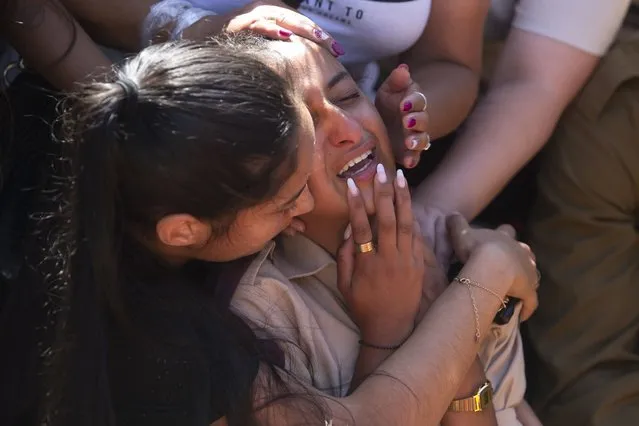 Friends and relatives of Israeli soldier Omer Tabib, 21, mourn during his funeral at the cemetery in the northern Israeli town of Elyakim, Thursday, May 13, 2021. The Israeli army confirmed that Tabib was killed in an anti-tank missile attack near the Gaza Strip, the first Israeli military death in the current fighting between Israelis and Palestinians. (Photo by Sebastian Scheiner/AP Photo)