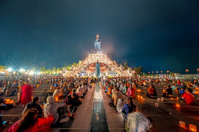 Monks, nuns, Buddhists, and tourists take part in the Vu Lan festival, also known as the Ghost festival or the Wondering Souls festival at Bo Den Mountain in South Vietnam in the last decade of August 2023. (Photo by Bui Van Hai/Solent News)