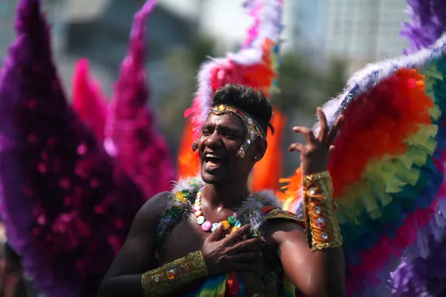 A reveller performs during the Gay Pride Parade at the Copacabana beach in Rio de Janeiro, Brazil, December 11, 2016. (Photo by Pilar Olivares/Reuters)