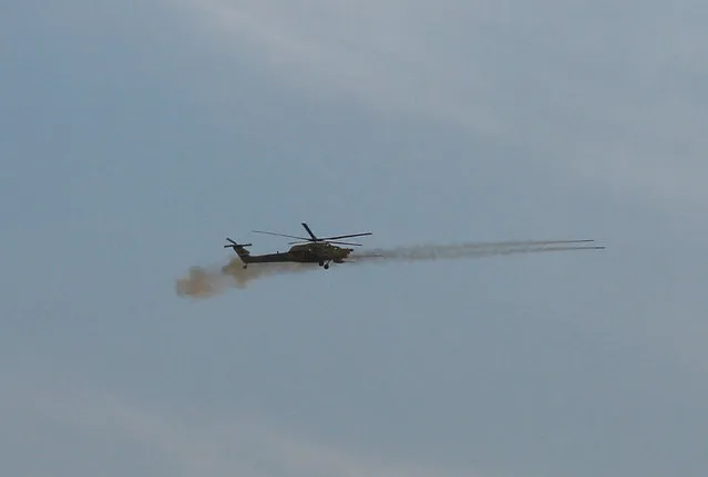 An Iraqi air force helicopter fires missiles during a battle with Islamic State militants, north of Mosul, Iraq, December 29, 2016. (Photo by Ammar Awad/Reuters)