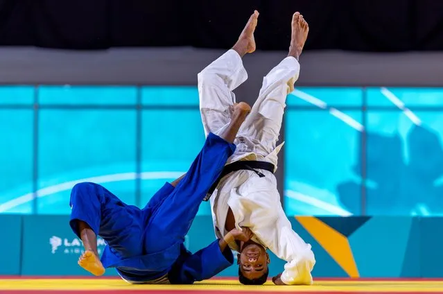 Robert Florentino of the Dominican Republic flips Daniel Paz of Columbia during the Men's 90k Bronze Medal judo competition on Day 10 at the Santiago 2023 Pan Am Games on October 30 2023 in Santiago, Chile. (Photo by Al Bello/Getty Images)