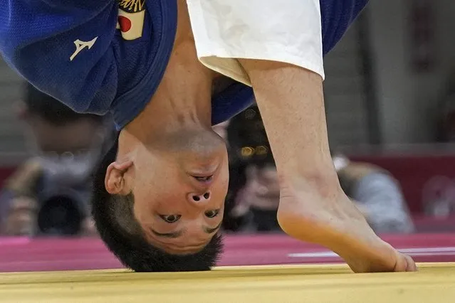 Shohei Ono of Japan, looks as he competes with Alexandru Raicu of Romania during their men's -73kg elimination round of the judo match at the 2020 Summer Olympics in Tokyo, Japan, Monday, July 26, 2021. (Photo by Vincent Thian/AP Photo)