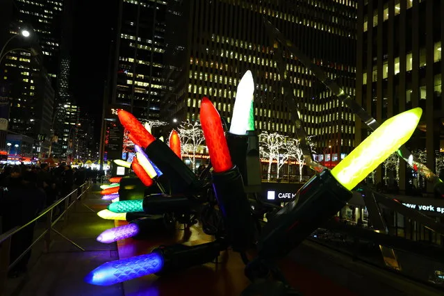 Giant Christmas lights line the sidewalk near Radio City Music Hall in New York City on December 19, 2018. (Photo by Gordon Donovan/Yahoo News)