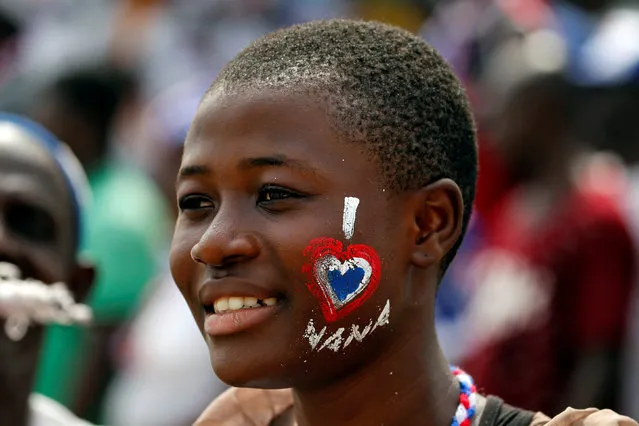 A supporter of Ghana's President Nana Akufo-Addo with face paint looks on during the inauguration of the president at the Independence Square in Accra, Ghana  January 7, 2017. (Photo by Luc Gnago/Reuters)