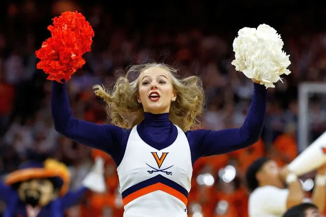 A cheerleader for the Virginia Cavaliers men’s basketball team on court during a timeout against the Texas A&M Aggies at John Paul Jones Arena in Virginia, US on November 29, 2023. (Photo by Geoff Burke/USA Today Sports)