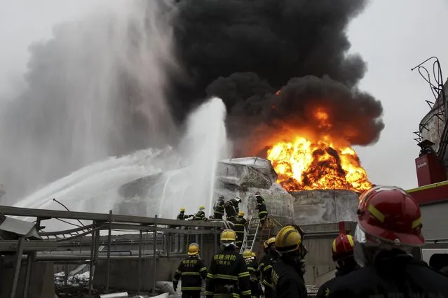 Firefighters try to extinguish a fire at a petrochemical plant in Zhangzhou, Fujian province April 7, 2015. (Photo by Reuters/Stringer)