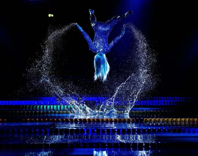 An artist performs during the opening ceremony of the LEN European Short Course Swimming Championship in Herning, Denmark, on December 12, 2013. (Photo by Henning Bagger/Scanpix)