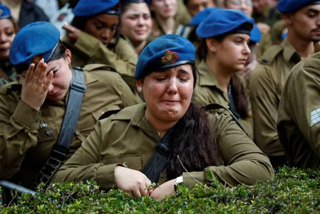 Israeli military members react during the funeral of Israeli soldier Avraham Fetena, who died from wounds sustained during Israel's ongoing ground operation in Gaza, in Haifa, Israel on November 17, 2023. (Photo by Shir Torem/Reuters)