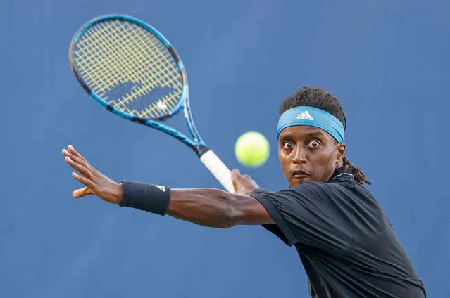 Mikael Ymer, of Sweden, prepares to hit the ball to Max Purcell, of Australia, at the Winston-Salem Open tennis tournament in Winston-Salem, N.C., Wednesday, August 25, 2021. (Photo by Nell Redmond/AP Photo)
