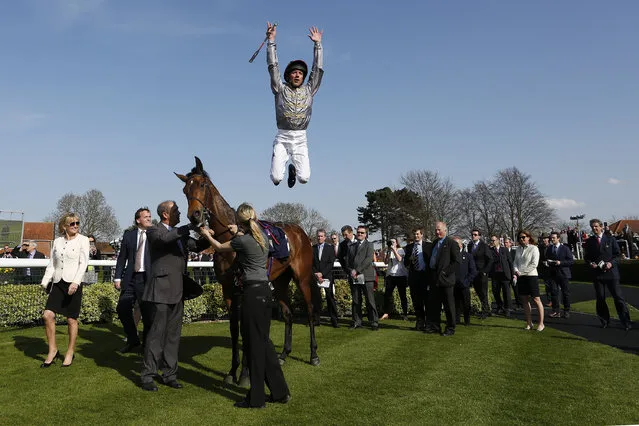 Frankie Dettori leaps in the winners enclosure after riding to win Osaila The Lanwades Stud Nell Gwyn Stakes at Newmarket racecourse on April 15, 2015 in Newmarket, England. (Photo by Alan Crowhurst/Getty Images)