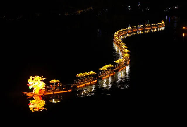 A dragon boat cruises on a river at night to welcome the Spring Festival on January 27, 2024 in Huangshan, Anhui Province of China. The Spring Festival, or the Chinese Lunar New Year, falls on February 10 this year. (Photo by Shi Yalei/VCG via Getty Images)