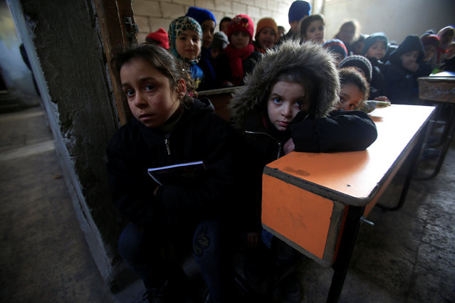 Children attend a classroom in Aleppo, Syria January 30, 2017. (Photo by Ali Hashisho/Reuters)