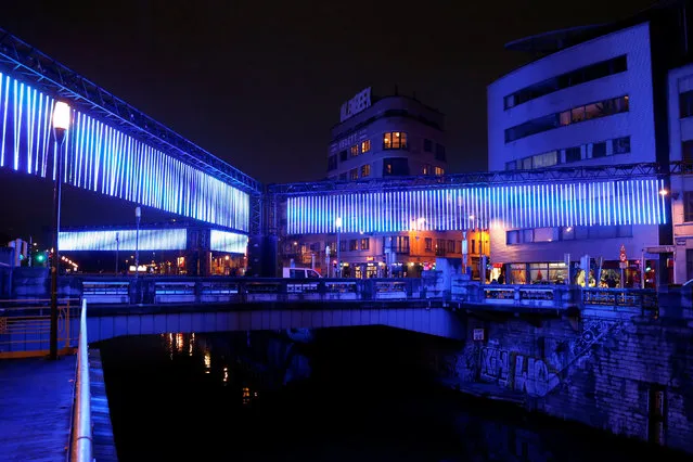 An artistic light installation illuminates the canal near the Brussels district of Molenbeek during the Bright Brussels Festival in Brussels, Belgium February 4, 2017. (Photo by Francois Lenoir/Reuters)