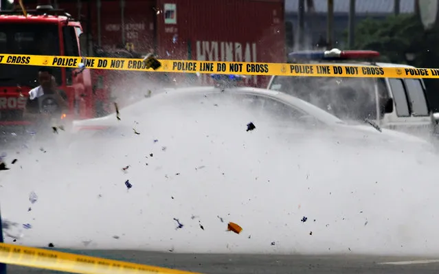 An improvised explosive device is detonated by members of the Philippine National Police (PNP) Explosives Ordnance Division during a bomb disposal exercise along a main street in metro Manila, Philippines February 10, 2017. (Photo by Romeo Ranoco/Reuters)