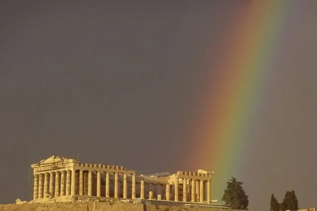 A rainbow appears over the ancient Acropolis during a rain shower in central Athens, Greece, Monday, January 29, 2024. Snow is expected to reach the outskirts of the capital later this week. (Photo by Derek Gatopoulos/AP Photo)